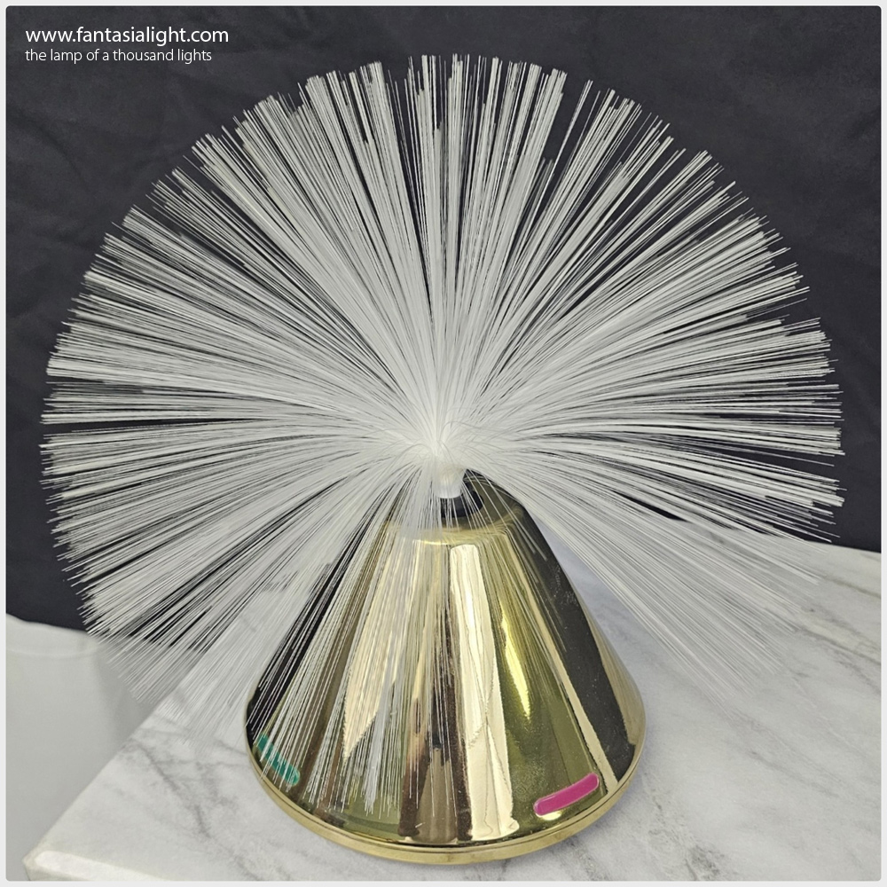 Fantasia Saturn - Model 2050 Cone shaped base with colorful illuminated segments on the base. Model produced by Vicon.
